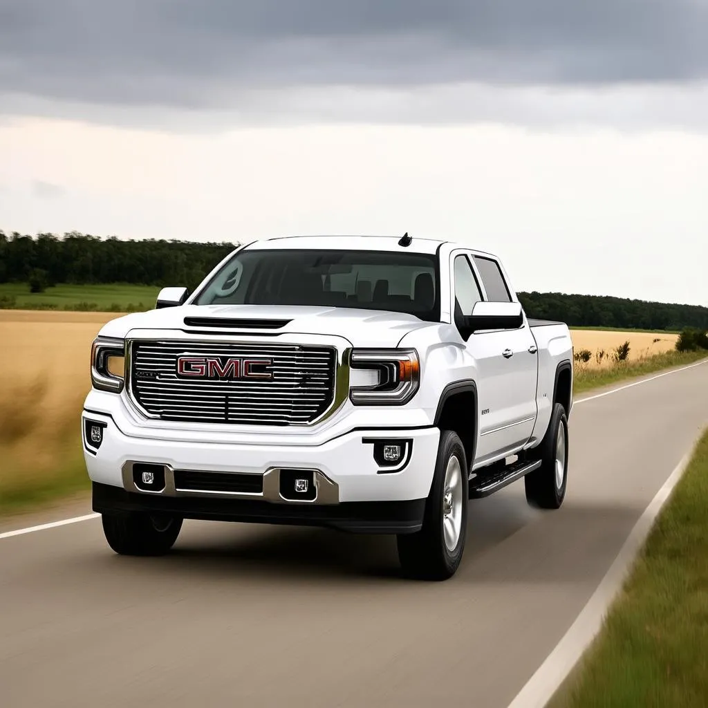 Un GMC Sierra roulant sur une route de campagne