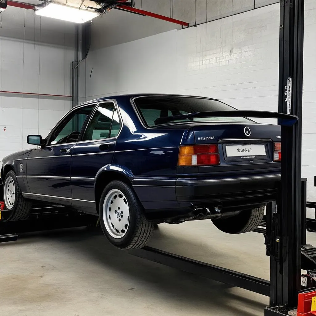 Une voiture européenne sur un pont élévateur dans un garage