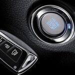 Close-up of a Hyundai key fob and car ignition, illustrating keyless entry system components for Hyundai car remote programming guidance.