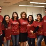 Alumni students pictured in their Primary Care Program shirts and with Primary Care Program Director, Dr. Jo Marie Reilly