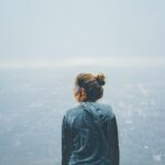 Thoughtful woman standing outside