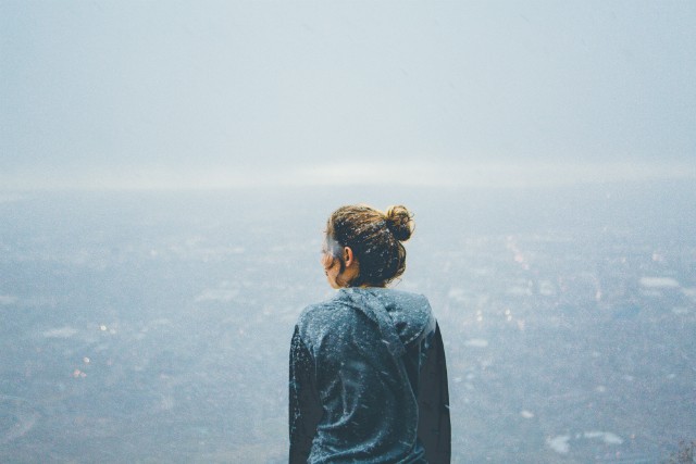 Thoughtful woman standing outside