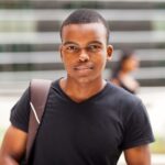 Young man looking thoughtful, representing adolescent mental health