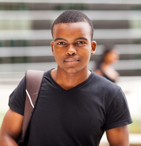 Young man looking thoughtful, representing adolescent mental health